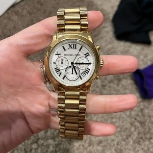 Michael kor gold watch, black writing